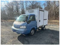 a white truck with a sold sign on it