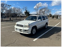 a white truck with a sold sign on it