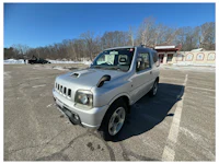a white truck with a sold sign on it